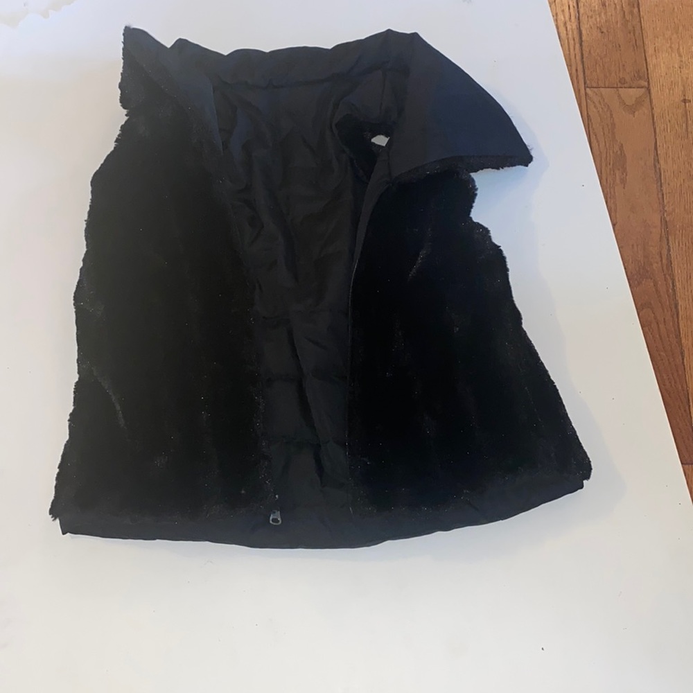 Fur reversible vest.